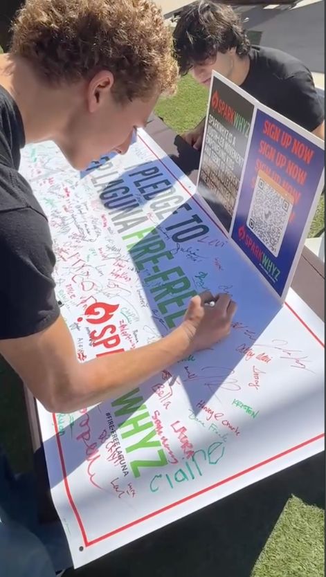 Students signing the SparkWhyz pledge